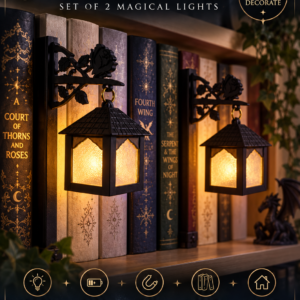 Pair of gothic bookshelf lanterns glowing amber beside books